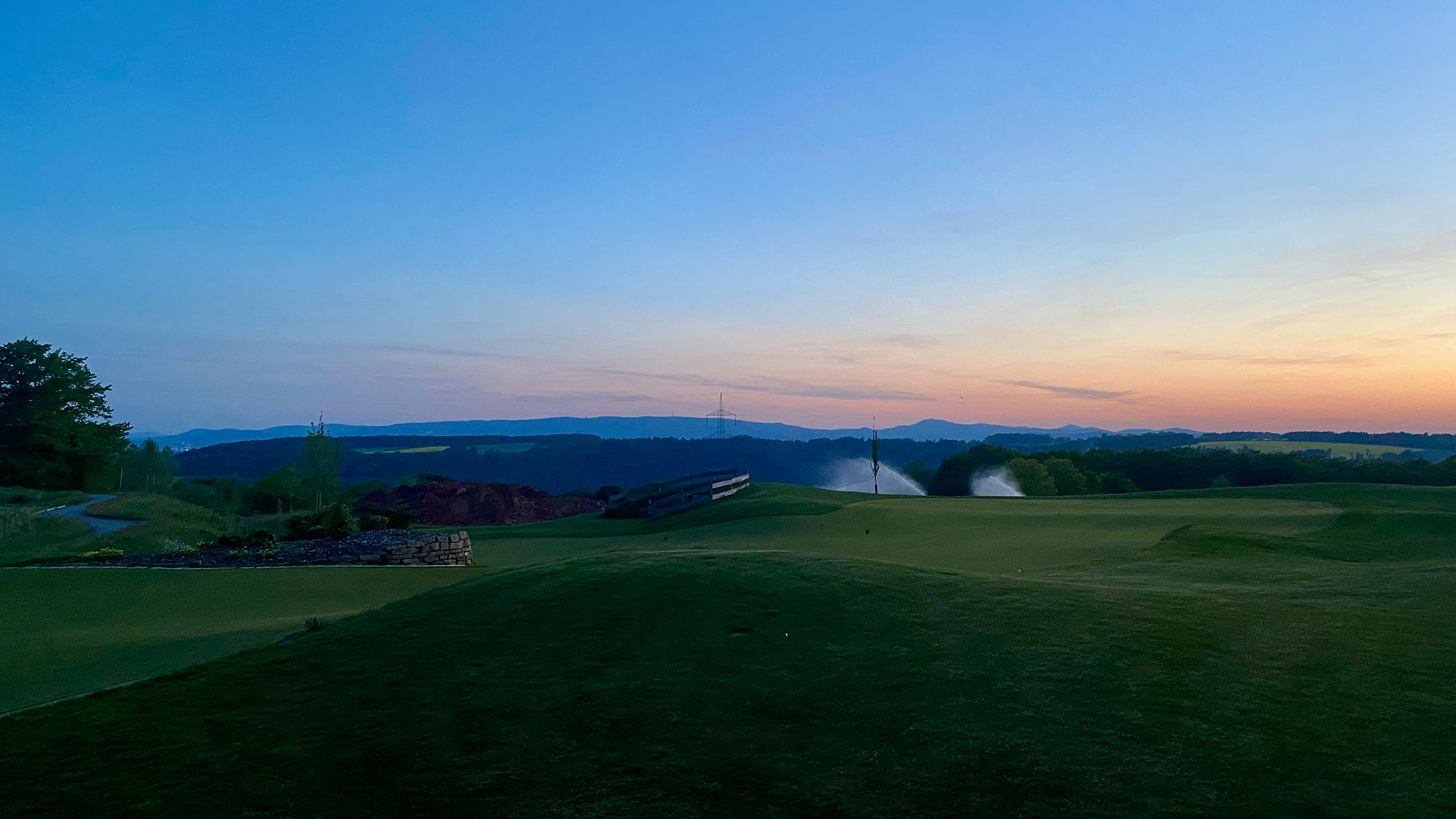 View of the golf course from our hotel in Germany during sunset