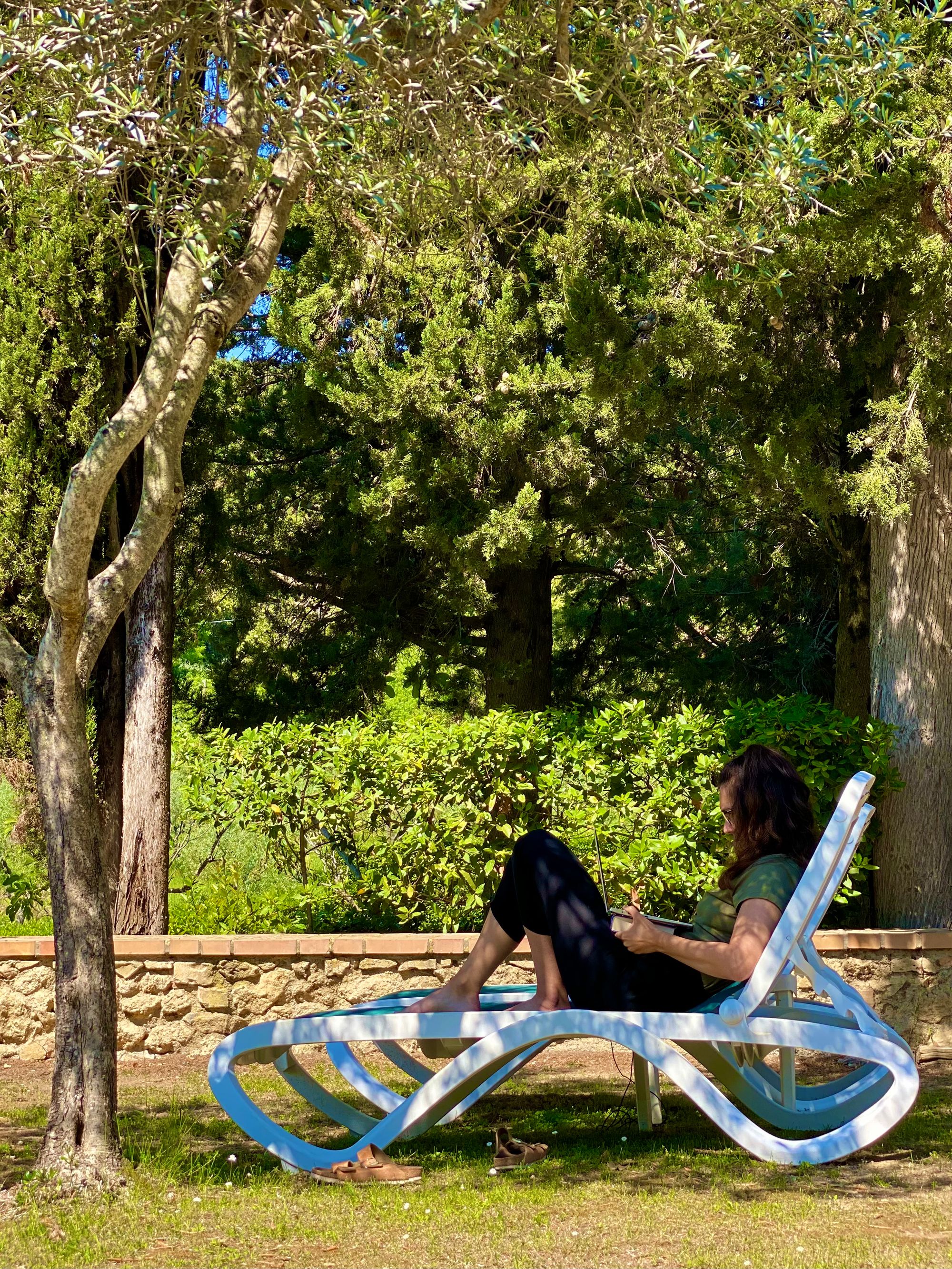 My wife relaxing in the backyard of Hotel Pescille - San Gimignano, Italy