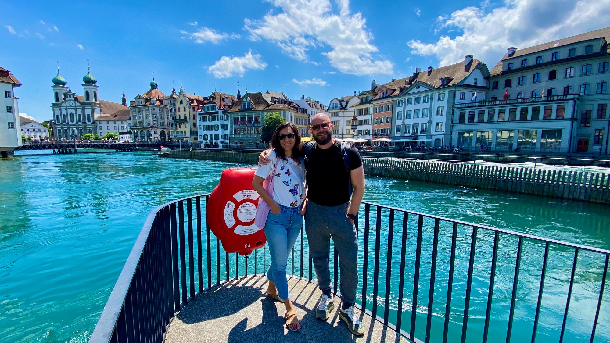 Picture of me and my wife in Lucerne standing on a bridge over river Reuss