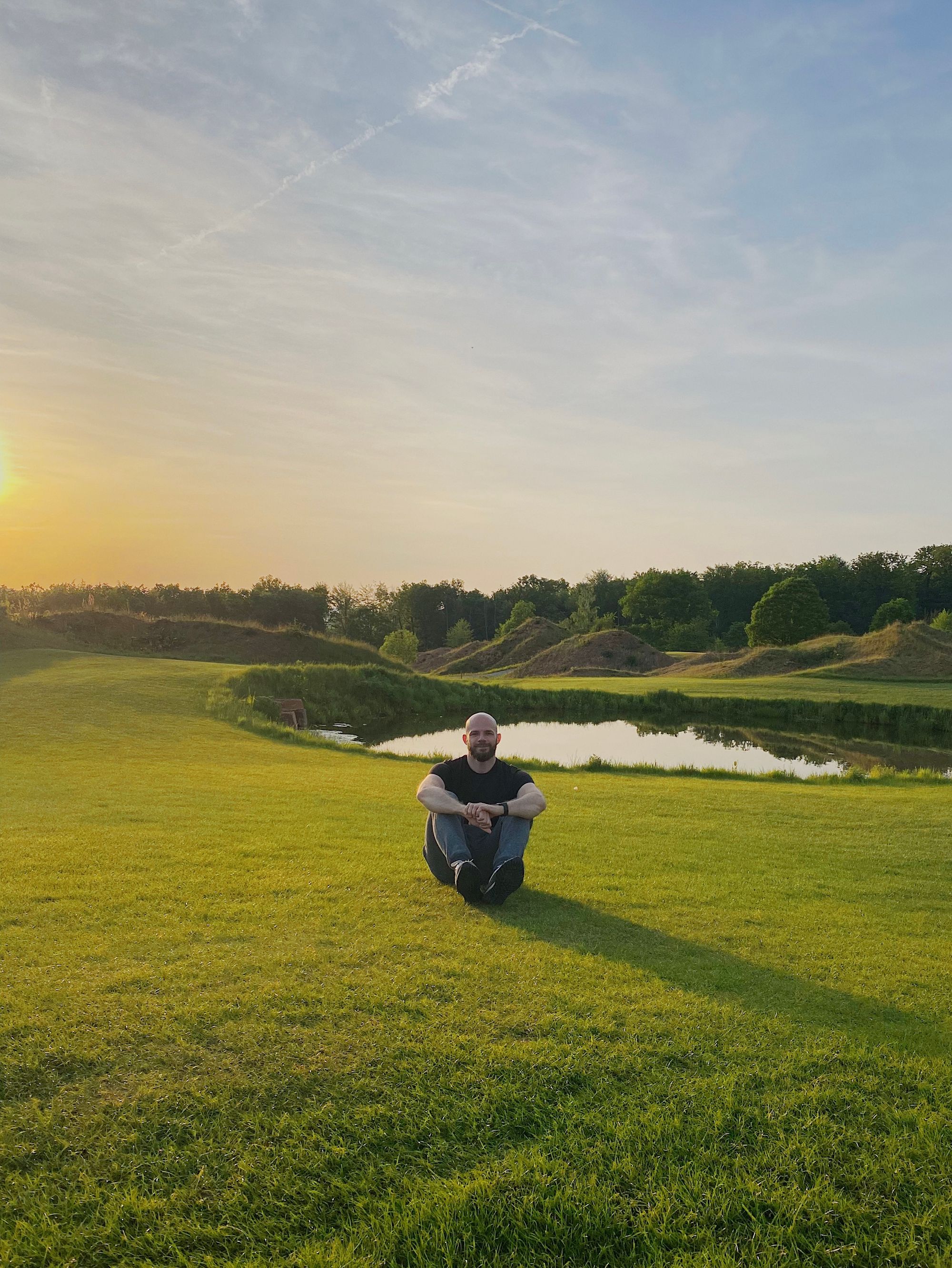 Me ralaxing on a grassfield after a day of driving