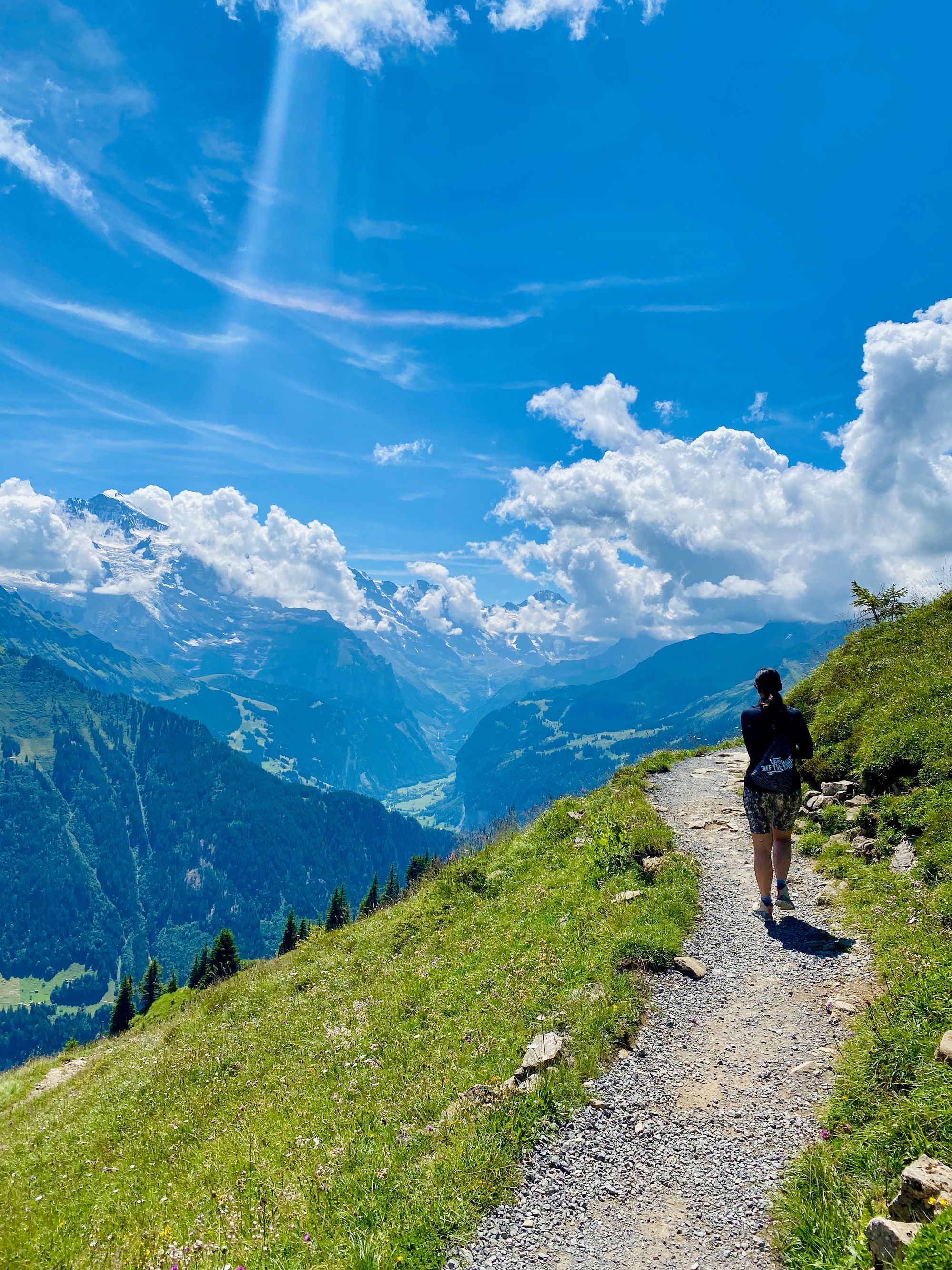 Silvia on a trail on the swiss mountains with Lauterbrunnen valley in the background