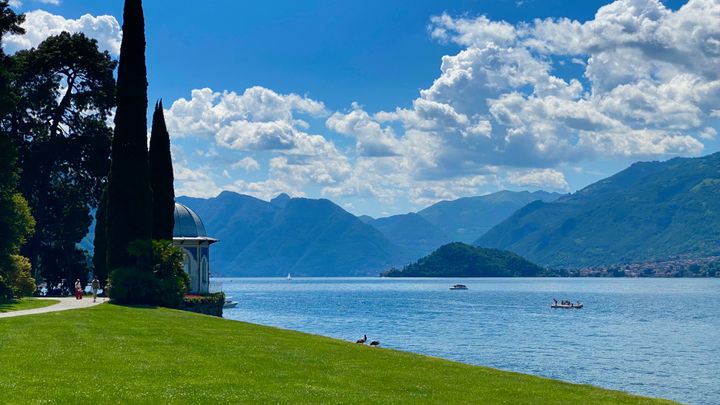 View of Lake Como blue water with the mountains in the background